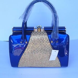 Blue bejeweled hand/strap purse